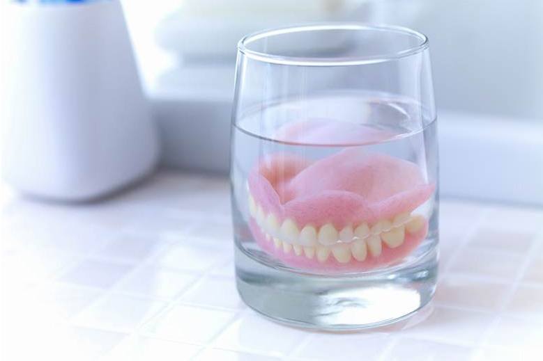 Dentures soaking in glass at Crowsnest Dental in Blairmore, Alberta